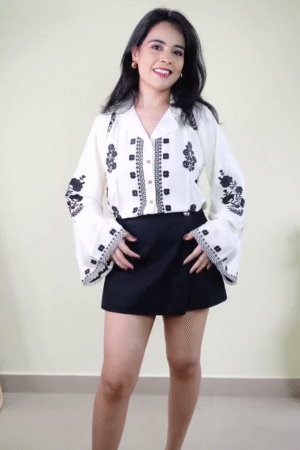 White Bell-Sleeve Boho Embroidered Tie-Front Crop Top with Black Thread Floral Motifs Paired with High-Waist Solid Black Mini Skirt